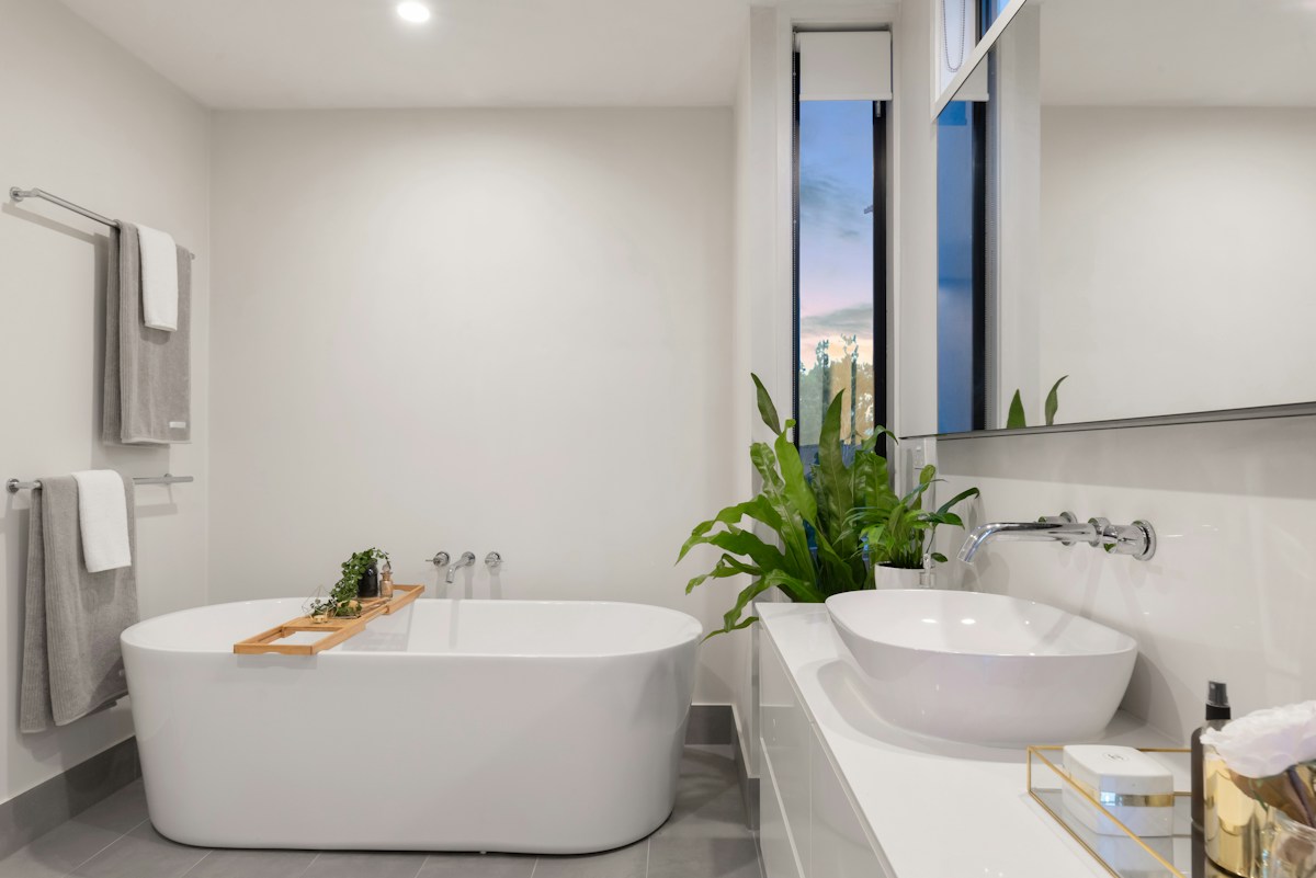 Bright bathroom with a vanity and neatly arranged fixtures
