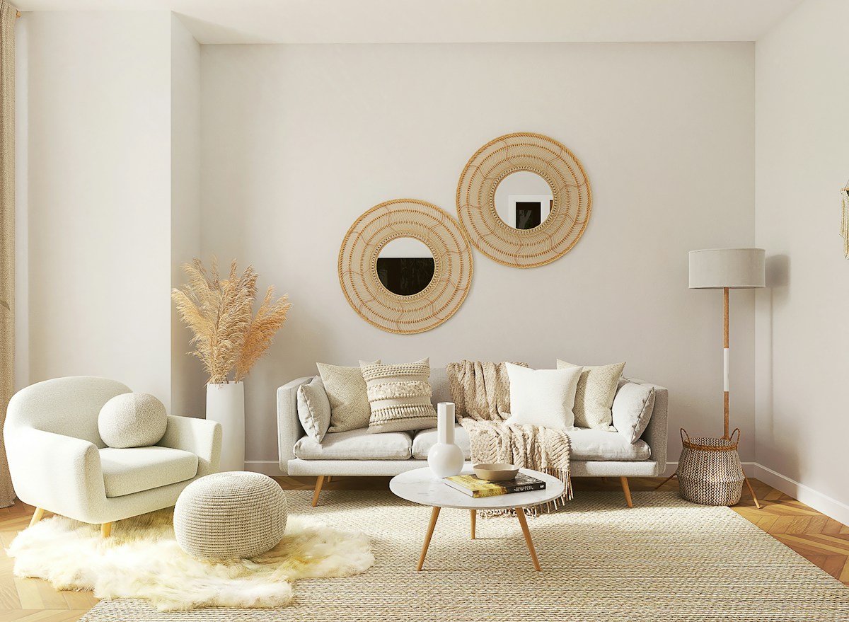 Light-filled living room with neutral seating and plants